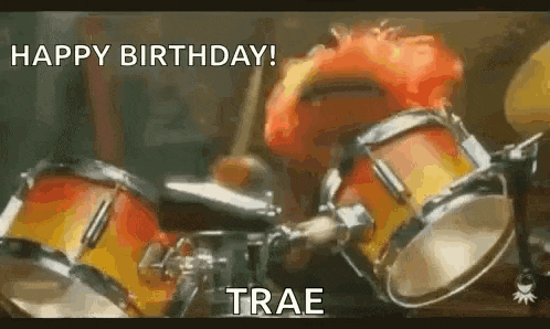elmo is playing drums in a happy birthday gif .