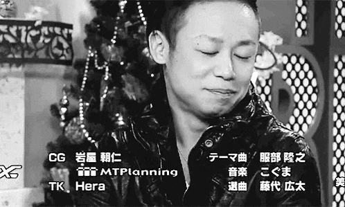 a black and white photo of a man in front of a christmas tree with the words tk hera at the bottom