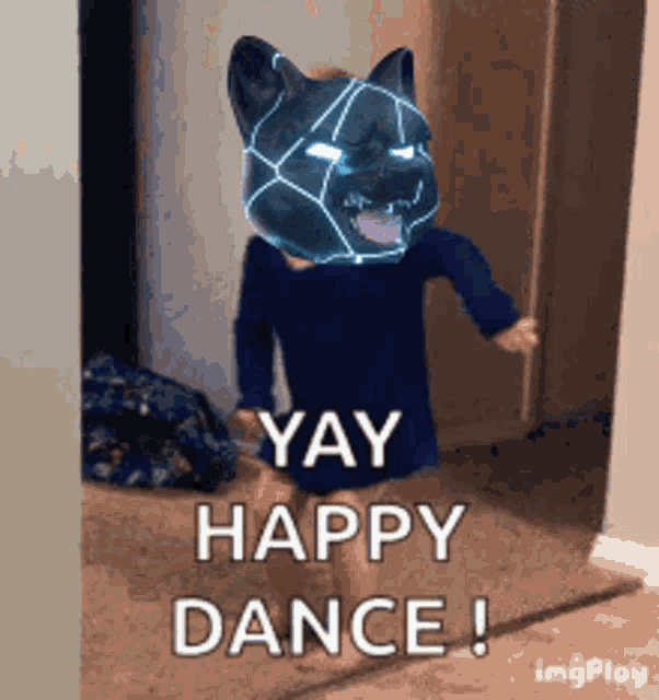 a little girl with a cat mask on her head says yay happy dance !