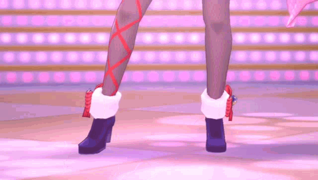 a close up of a girl 's legs wearing stockings and red ribbons .