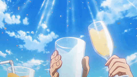 a person holding a glass of orange juice and a glass of wine