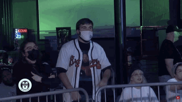 a man wearing a mask and a big boy jersey