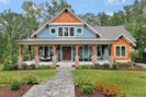 a blue and orange house with a walkway leading to it .