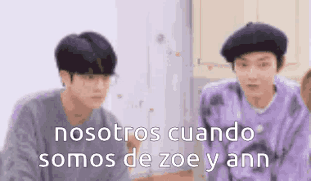 a couple of men standing next to each other in a kitchen with the words `` nosotros cuando somos de zoe y ann '' .