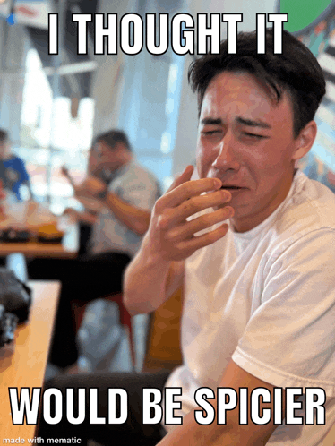 a man is crying in a restaurant with a meme that says i thought it would be spicier
