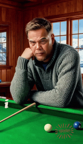 a man leans against a pool table with a sticker that says yayah