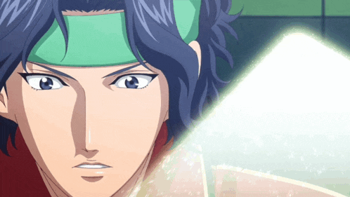 a close up of a person 's face with a headband on