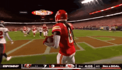 a football game is being played in a stadium with espn on the screen