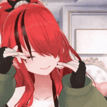 a girl with red hair is holding her hands to her ears