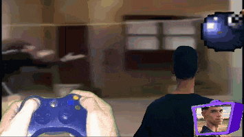 a pixelated image of a man playing a video game with a blue controller