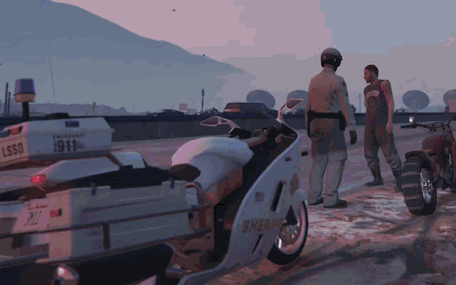 a sheriff 's motorcycle is parked next to a motorcycle