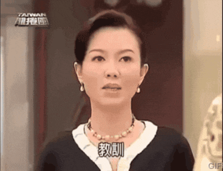 a woman is wearing a necklace and earrings and has the word taiwan written on her face
