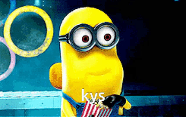 a cartoon minion is holding a bag of popcorn with the word kys written on it