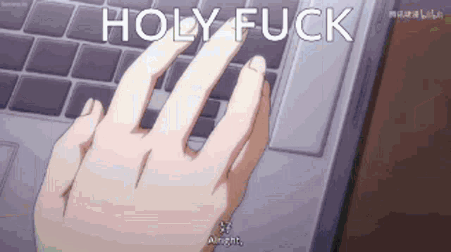 a person is typing on a laptop keyboard and the words holy fuck are visible