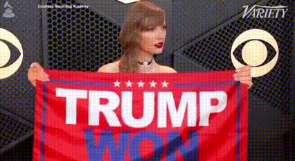 a woman is holding a red flag that says trump won
