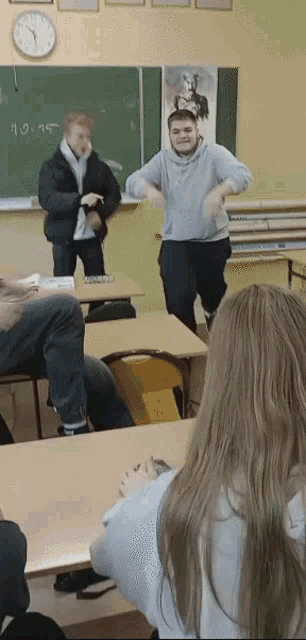 a classroom with a blackboard that says 90.95