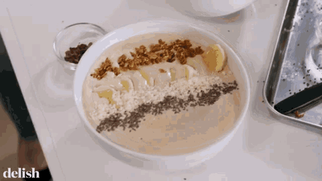 a bowl of food on a table with the word delish on the bottom