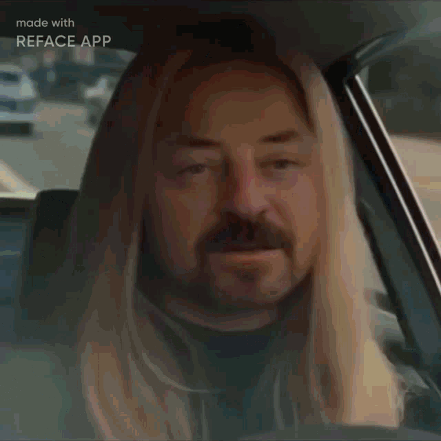 a man with blonde hair and a mustache is sitting on a couch made with reface app
