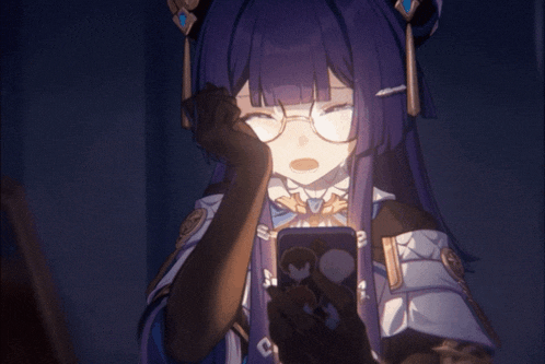 a girl with glasses is looking at a phone