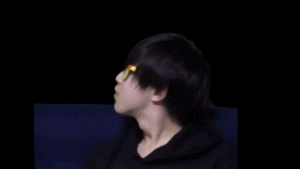 a man wearing glasses is surrounded by yellow letters that say " duco "