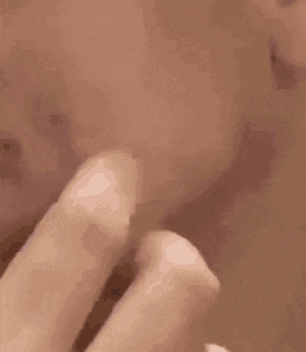 a close up of a person 's face with a circle around it
