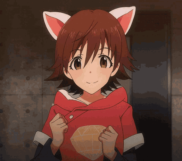 a girl with cat ears on her head is wearing a red shirt with a diamond on it