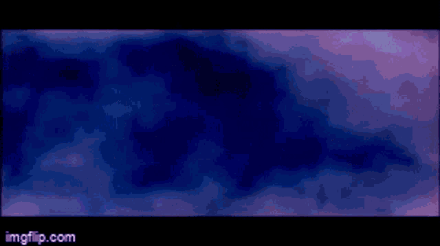 a purple light is coming out of a blue circle on a blue background .