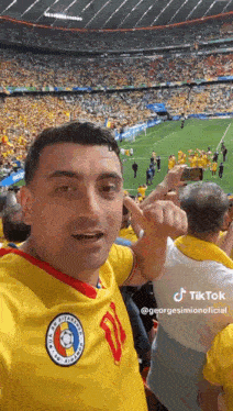 a man wearing a yellow jersey with the number 11 on it