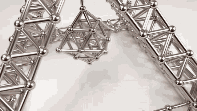 a heart made of metal balls and sticks