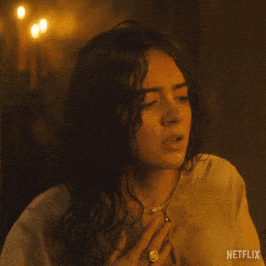 a close up of a woman 's face with netflix written on the bottom right