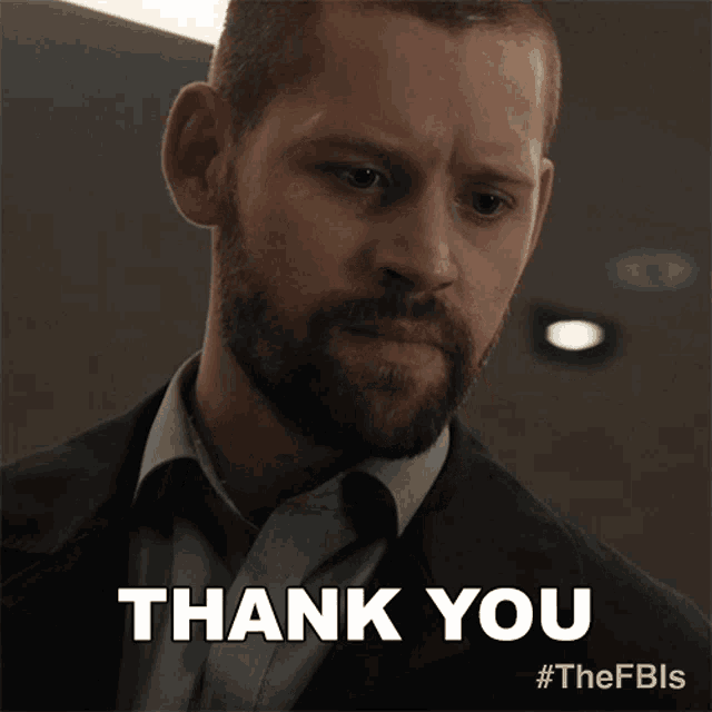a man with a beard is giving a thank you