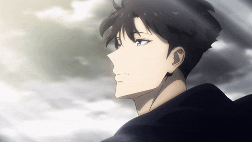a man with headphones on his ears looks at the sky