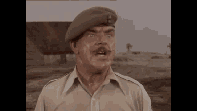 a man in a military uniform with a beret on his head is making a funny face