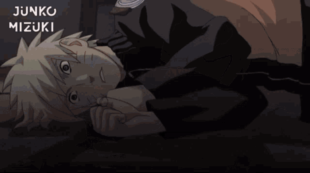 a cartoon of a man laying on the floor with junko mizuki written on the top