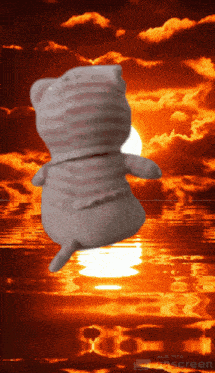 a stuffed animal is floating in the air with a sunset in the background made with extrascreen