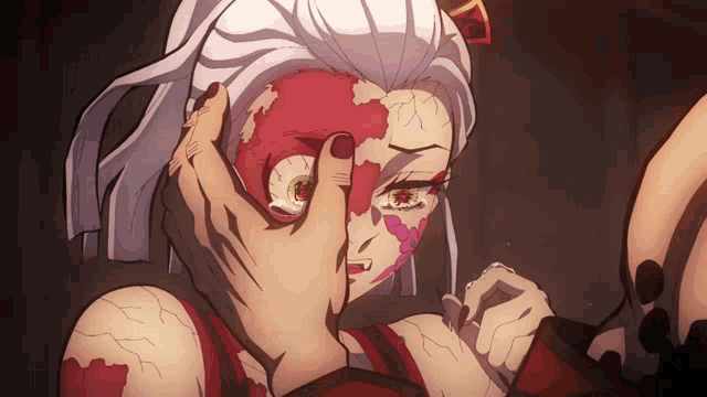 a woman with blood on her face is being held by another person