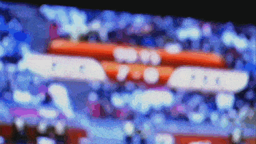 a blurry picture of a stadium with the letters bbc on the bottom