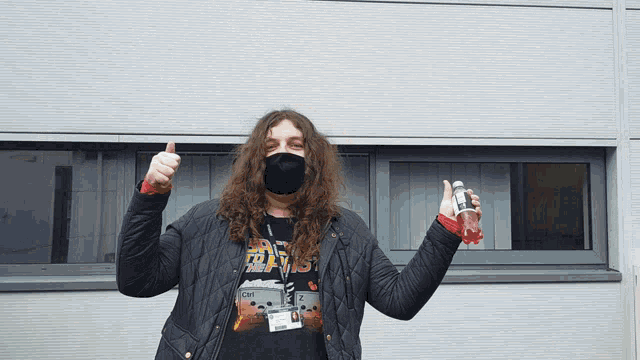 a man wearing a mask and a star wars shirt