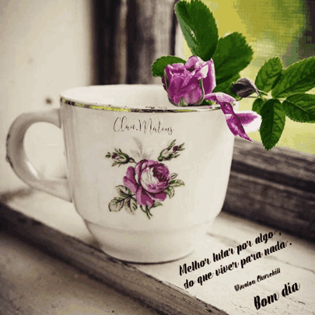 a white cup with purple flowers on it and a quote from uncle churchill