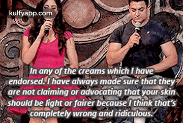 a man and a woman are standing next to each other holding microphones and a quote from kulfyapp.com