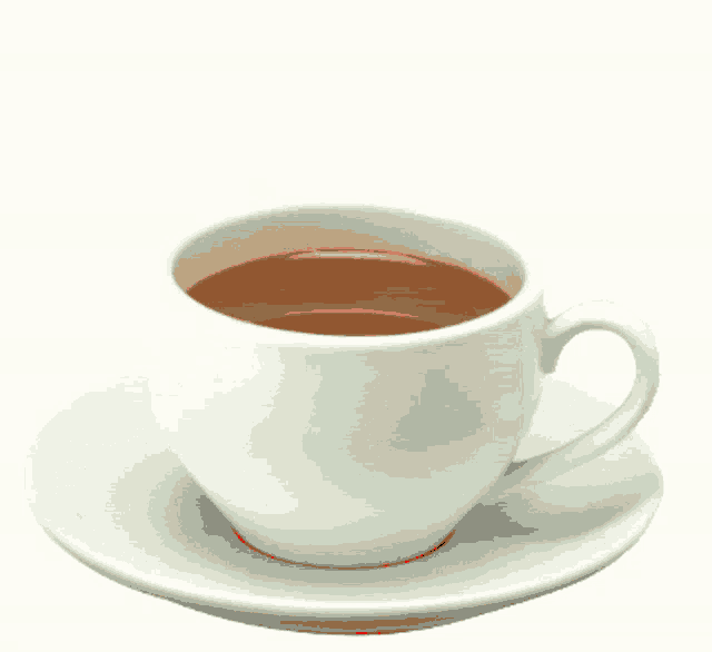 a cup of coffee sits on a saucer with the words " good morning " above it