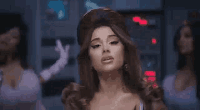 ariana grande is wearing a wig and gloves in a video for her new single .