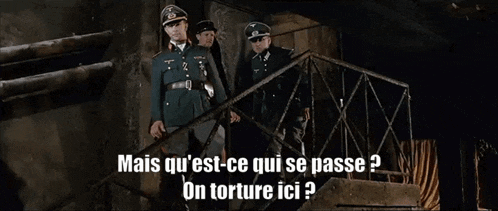 three men in military uniforms are standing on a set of stairs with the words mais qu 'est-ce qui se passe