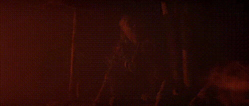 a close up of a person 's face in the dark .