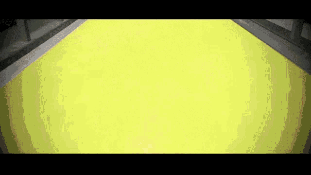 a yellow background with a black border and a few lines