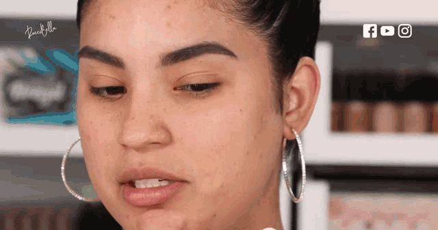 a close up of a woman 's face with a youtube logo on the bottom right