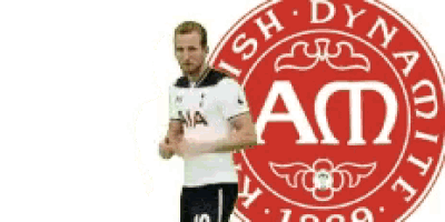 a man in a white shirt is standing in front of a red and white emblem that says ad