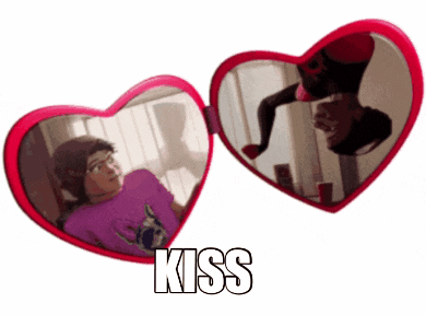 a pair of heart shaped mirrors with the word kiss on the bottom right