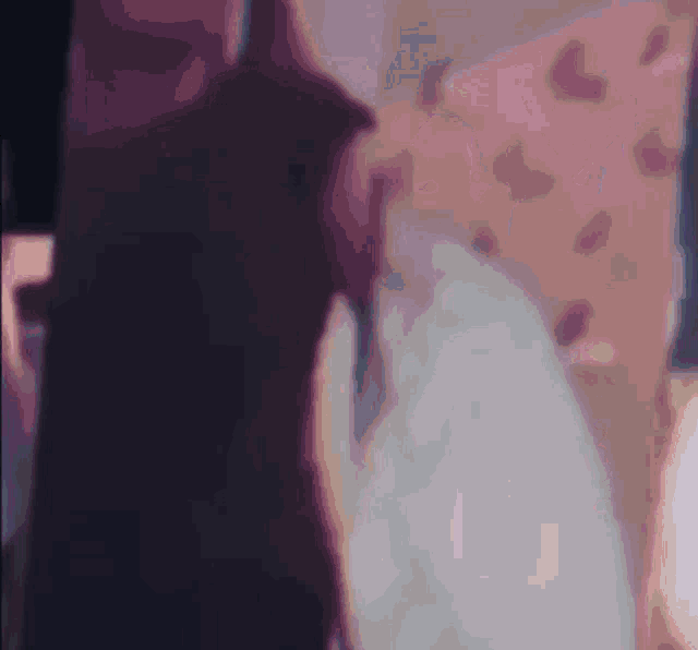 a close up of a person 's face with a blurred background .