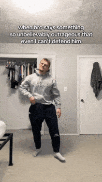 a man in a sweatshirt that says uwstout is dancing
